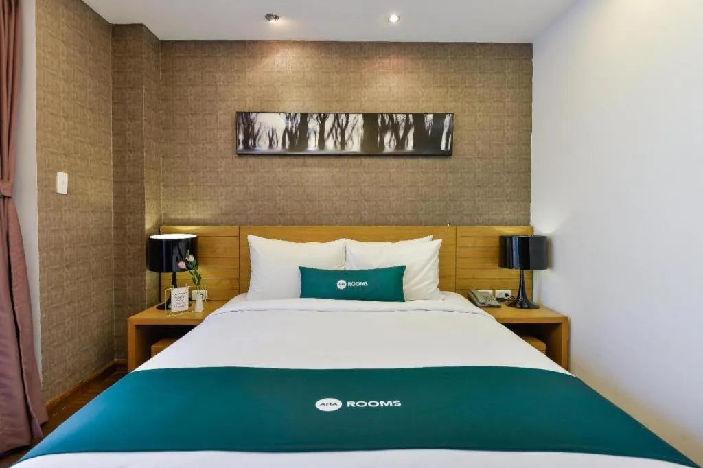 Bed in AHA Boutique Ben Thanh Hotel