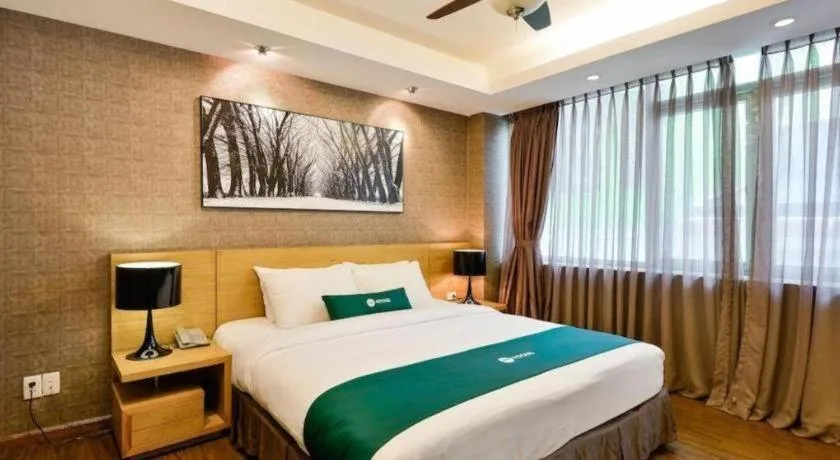 Bed in AHA Boutique Ben Thanh Hotel