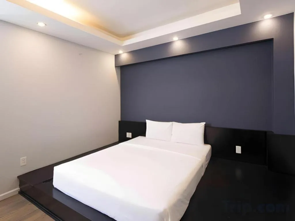 Bed in AHA Boutique Ben Thanh Hotel