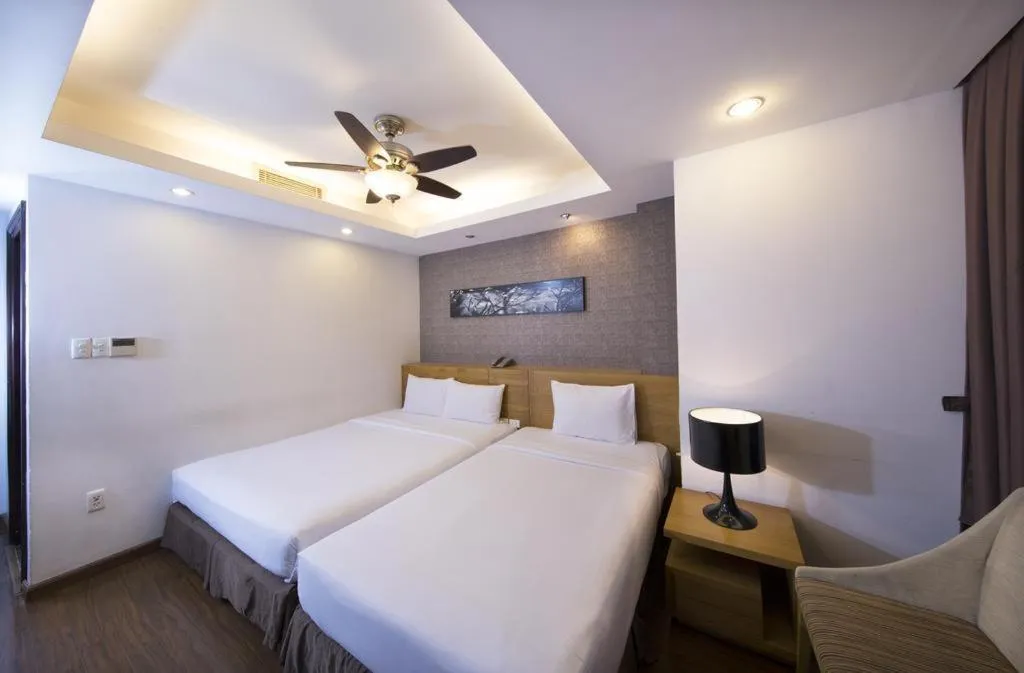 Bed in AHA Boutique Ben Thanh Hotel