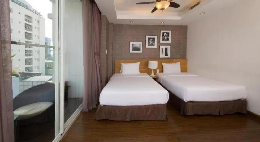 Bed in AHA Boutique Ben Thanh Hotel