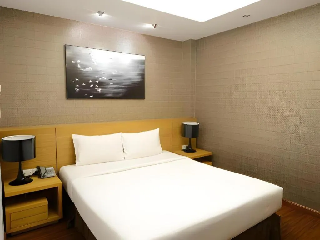 Bed in AHA Boutique Ben Thanh Hotel