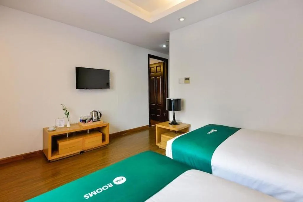 Bed in AHA Boutique Ben Thanh Hotel