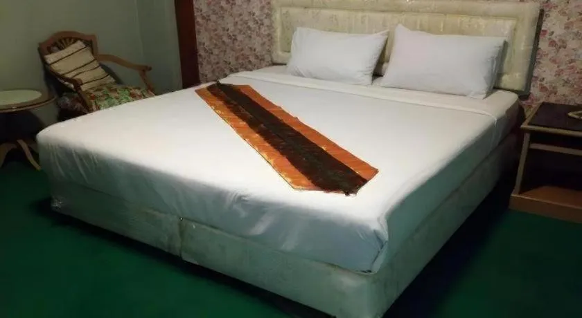 Bed in Chao Phya Grand Hotel