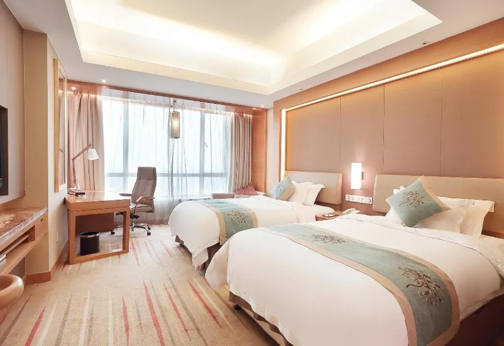 Bed in Howard Johnson by Wyndham Sunshine Plaza Ningbo