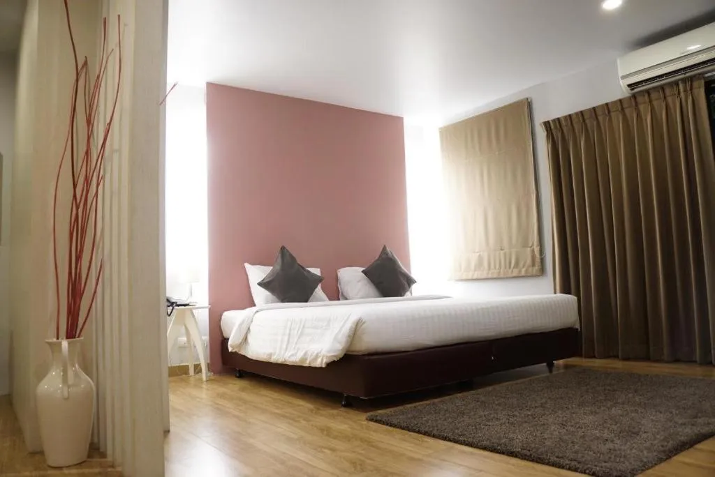 Bed in The One Residence Hotel