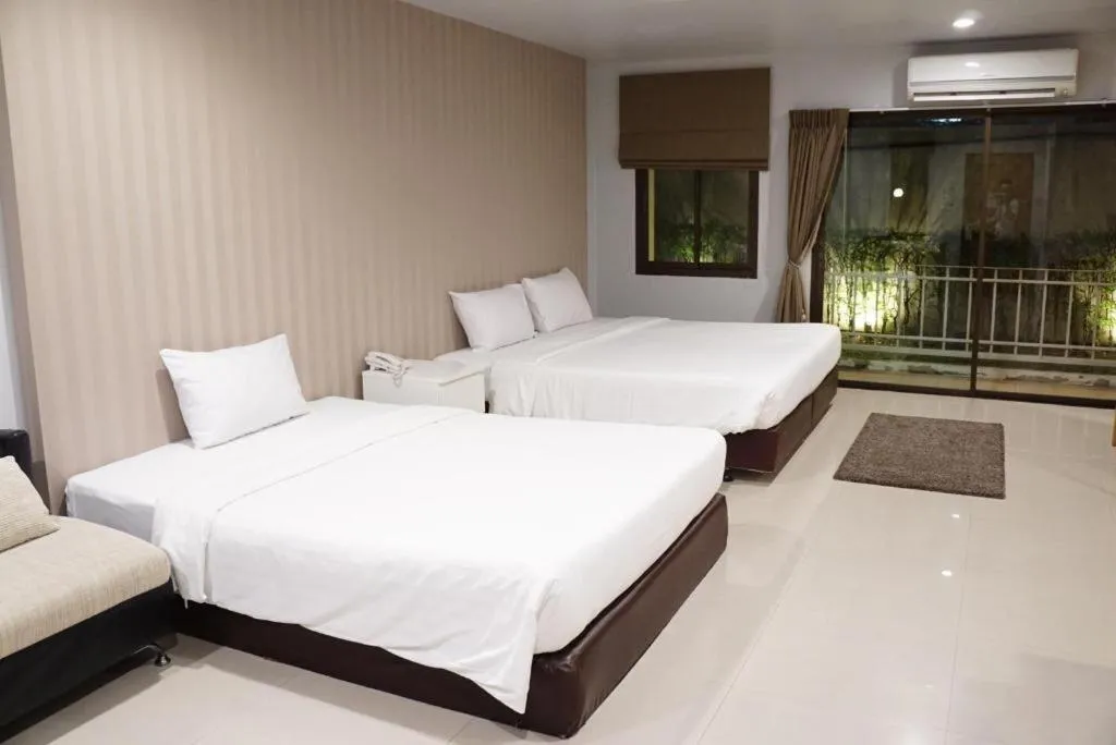 Bed in The One Residence Hotel