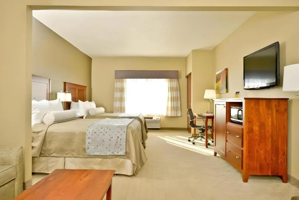 Bed in Green Mill Village Hotel & Suites, BW Signature Collection