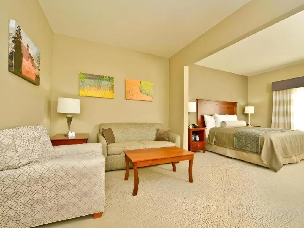 Bed in Green Mill Village Hotel & Suites, BW Signature Collection