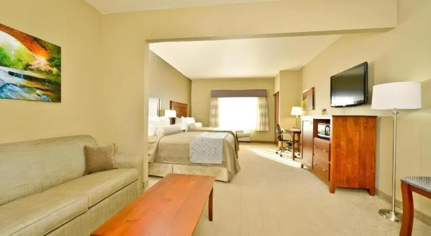 Bed in Green Mill Village Hotel & Suites, BW Signature Collection