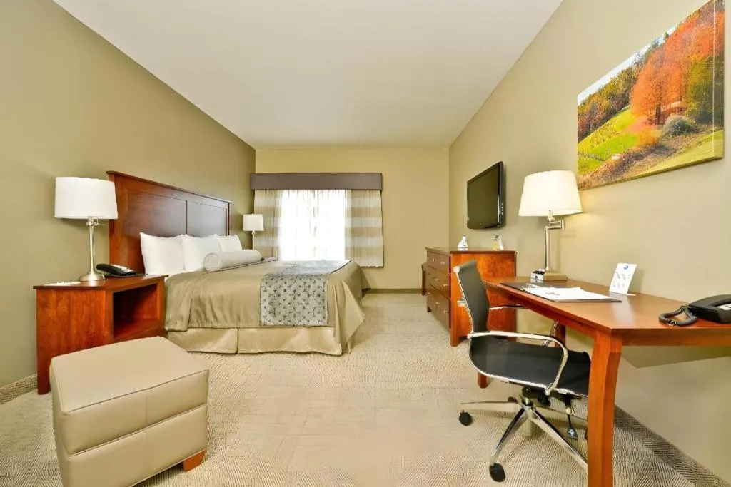 Bed in Green Mill Village Hotel & Suites, BW Signature Collection
