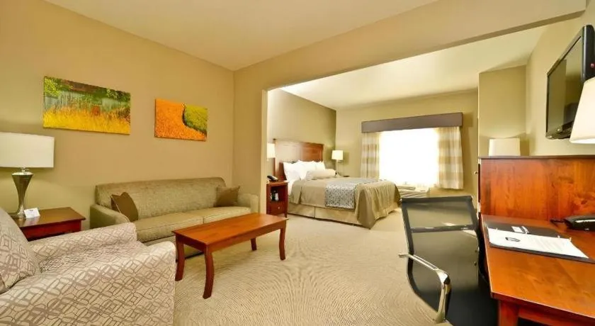 Bed in Green Mill Village Hotel & Suites, BW Signature Collection