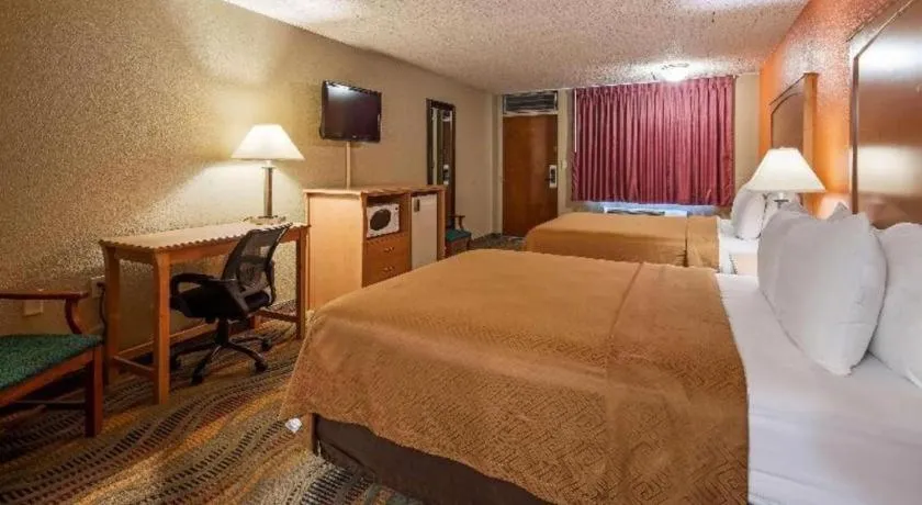 Bed in SureStay Hotel