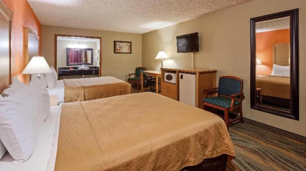 Bed in SureStay Hotel