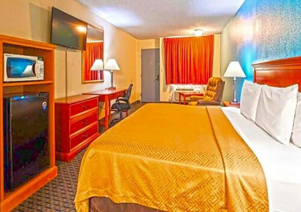 Bed in SureStay Hotel