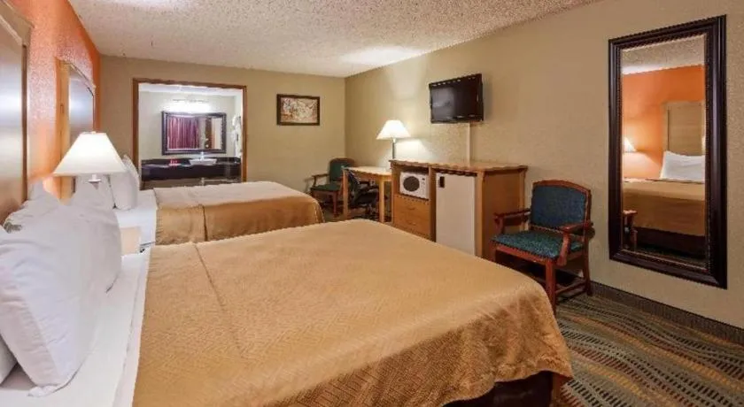 Bed in SureStay Hotel