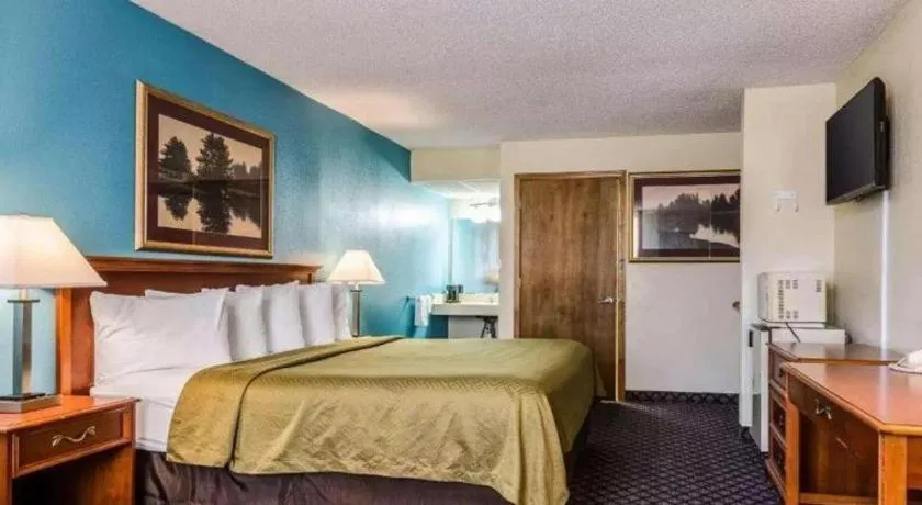 Bed in SureStay Hotel