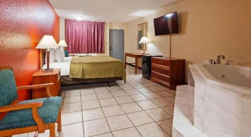 Bed in SureStay Hotel