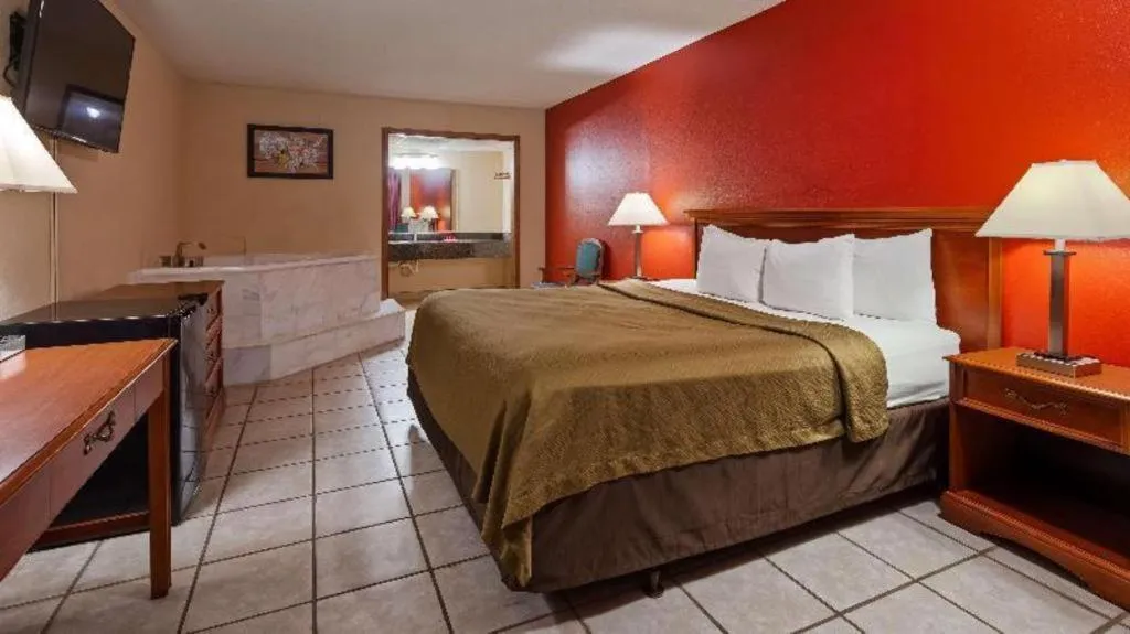 Bed in SureStay Hotel