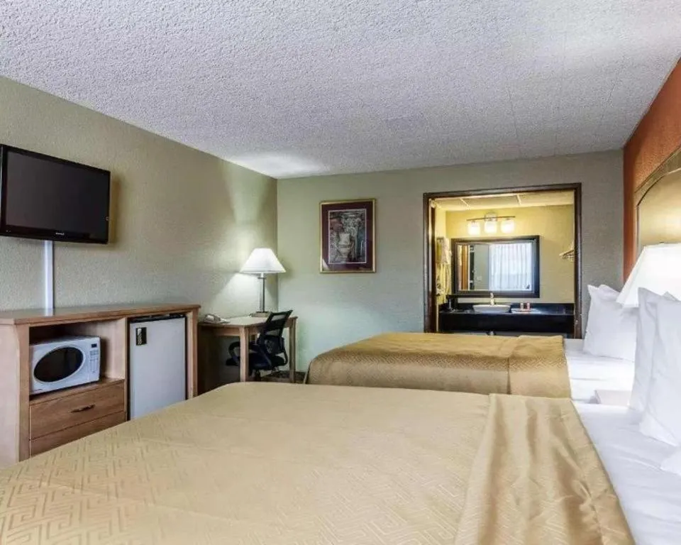 Bed in SureStay Hotel