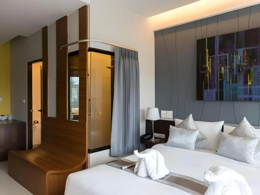 Bed in Vulcano Hotel at Nimman