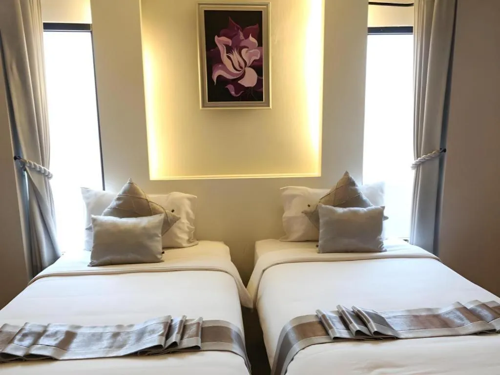 Bed in Vulcano Hotel at Nimman