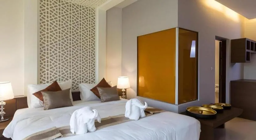 Bed in Vulcano Hotel at Nimman