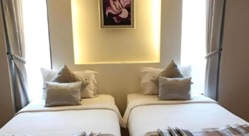 Bed in Vulcano Hotel at Nimman