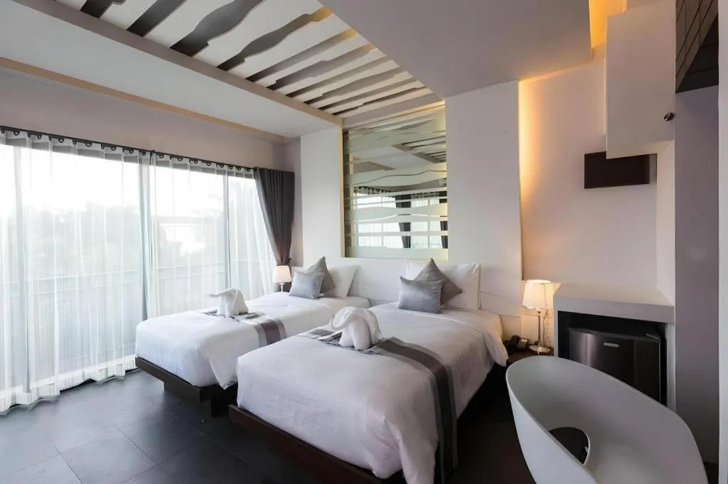 Bed in Vulcano Hotel at Nimman