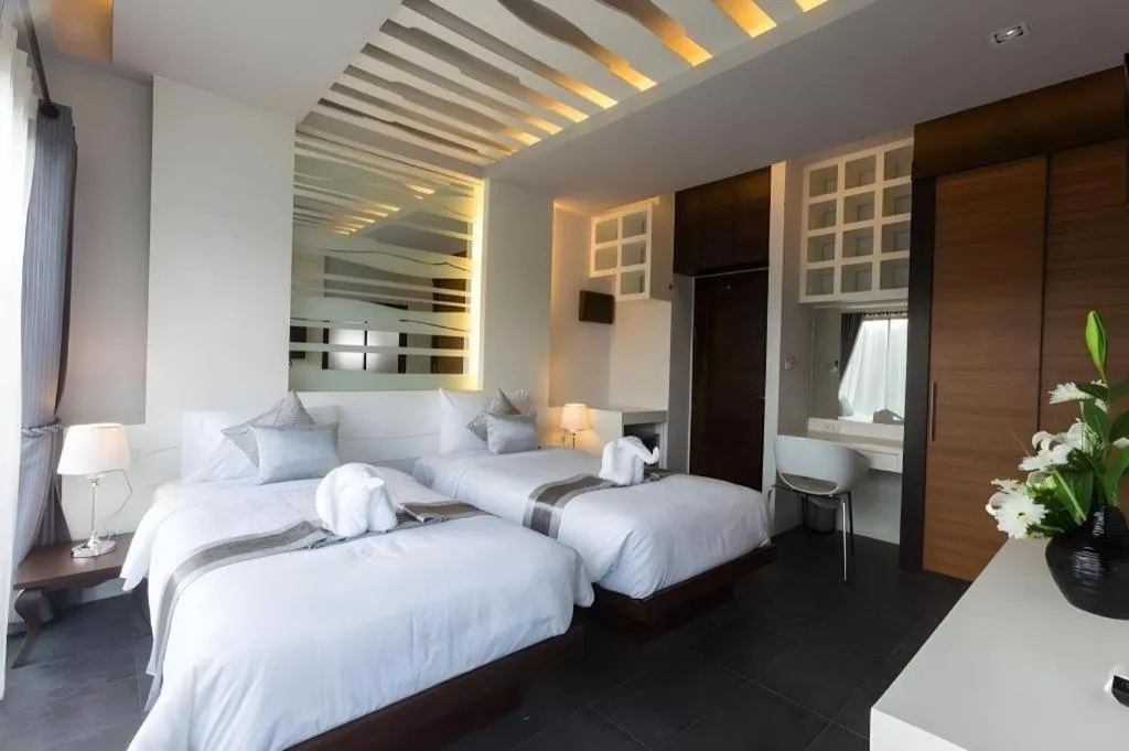 Bed in Vulcano Hotel at Nimman