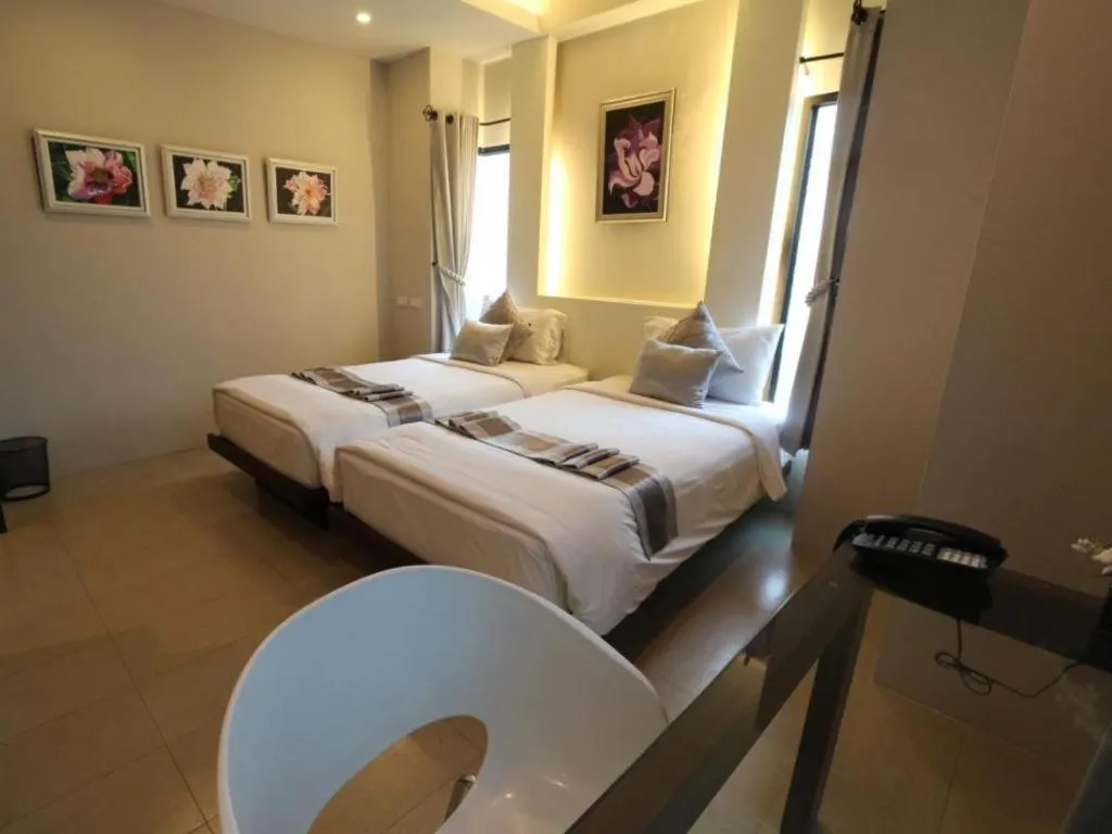 Bed in Vulcano Hotel at Nimman