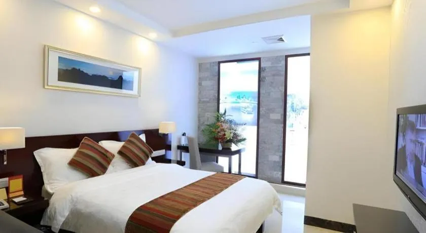 Bed in Nanfang Dasha Hotel