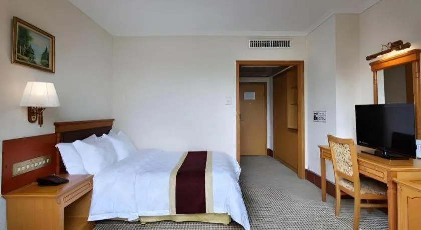 Bed in Nanfang Dasha Hotel