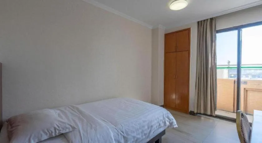 Bed in Nanfang Dasha Hotel