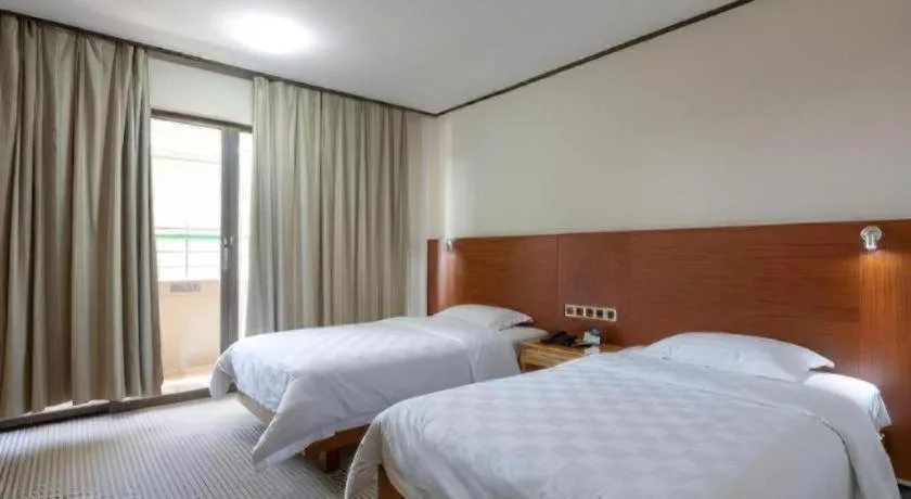 Bed in Nanfang Dasha Hotel