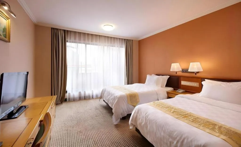 Bed in Nanfang Dasha Hotel