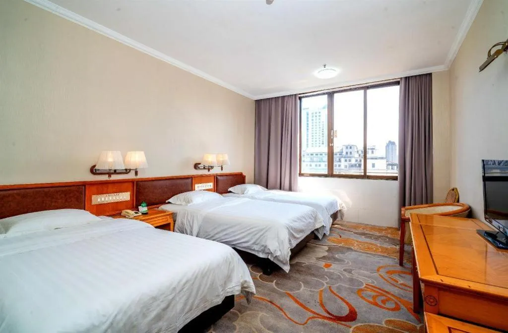 Bed in Nanfang Dasha Hotel