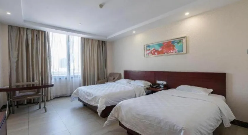 Bed in Nanfang Dasha Hotel