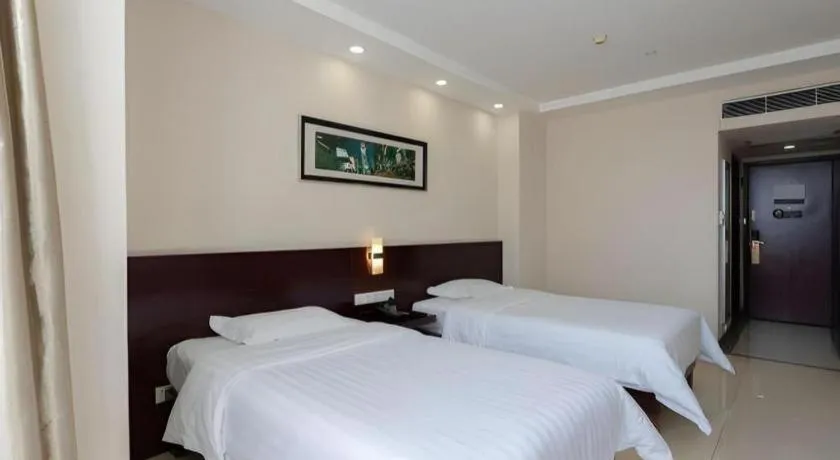 Bed in Nanfang Dasha Hotel