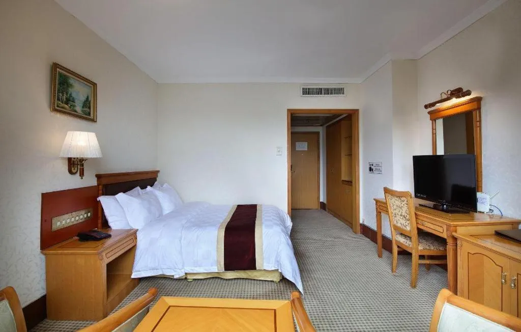 Bed in Nanfang Dasha Hotel