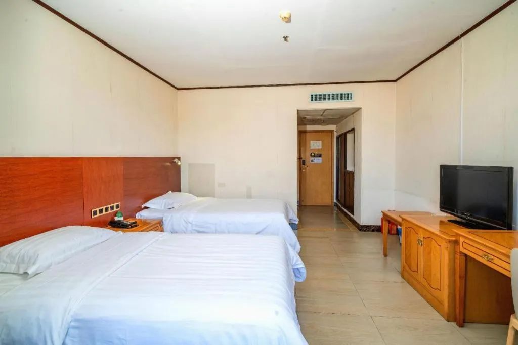 Bed in Nanfang Dasha Hotel