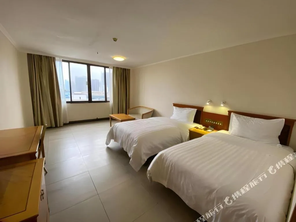 Bed in Nanfang Dasha Hotel