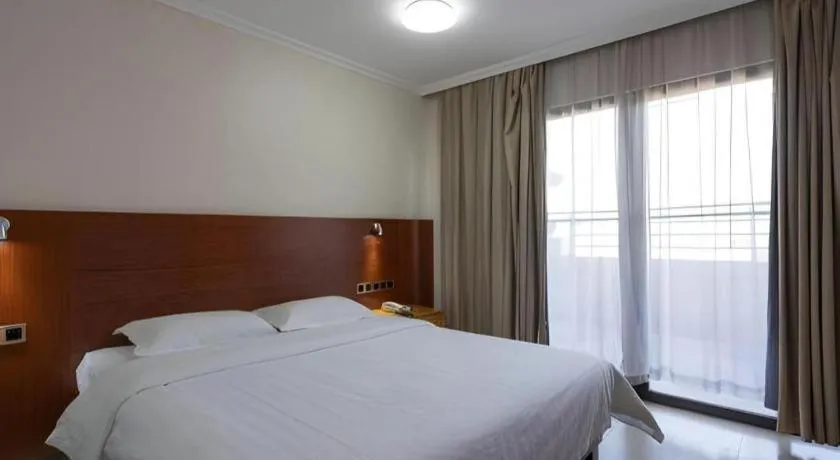 Bed in Nanfang Dasha Hotel