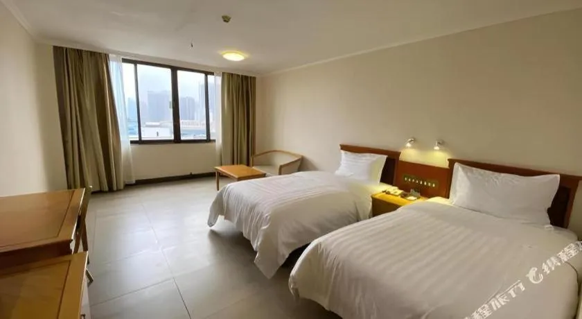 Bed in Nanfang Dasha Hotel