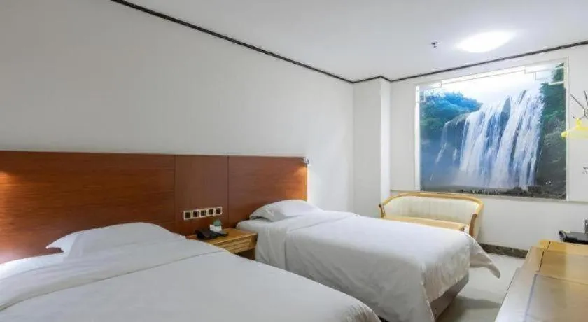 Bed in Nanfang Dasha Hotel