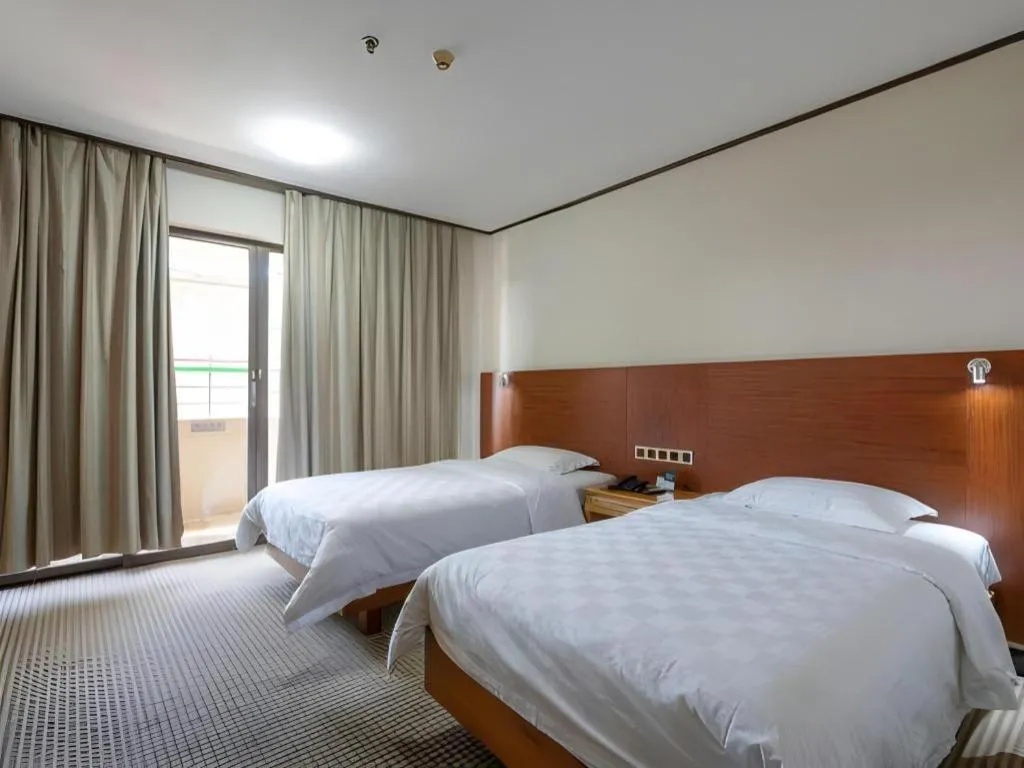 Bed in Nanfang Dasha Hotel