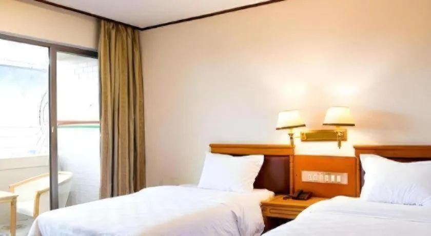 Bed in Nanfang Dasha Hotel