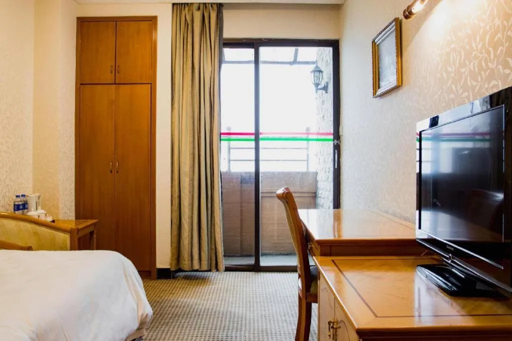 Bed in Nanfang Dasha Hotel