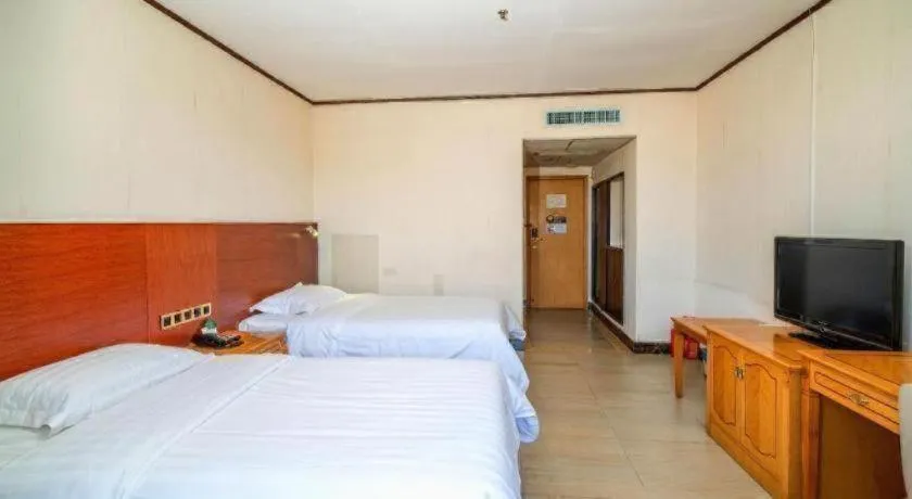 Bed in Nanfang Dasha Hotel