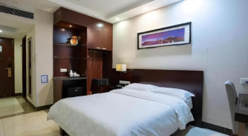 Bed in Nanfang Dasha Hotel
